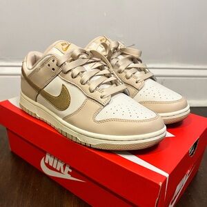 Nike Women’s Dunk Low “Gold Swoosh”